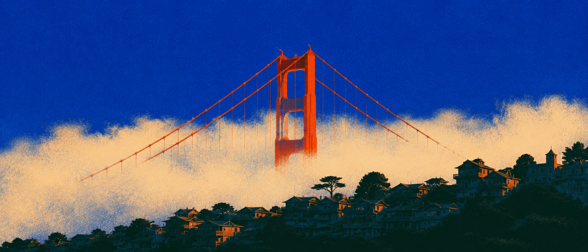 The Golden Gate Bridge rising out of low fog above the hillside houses of San Francisco